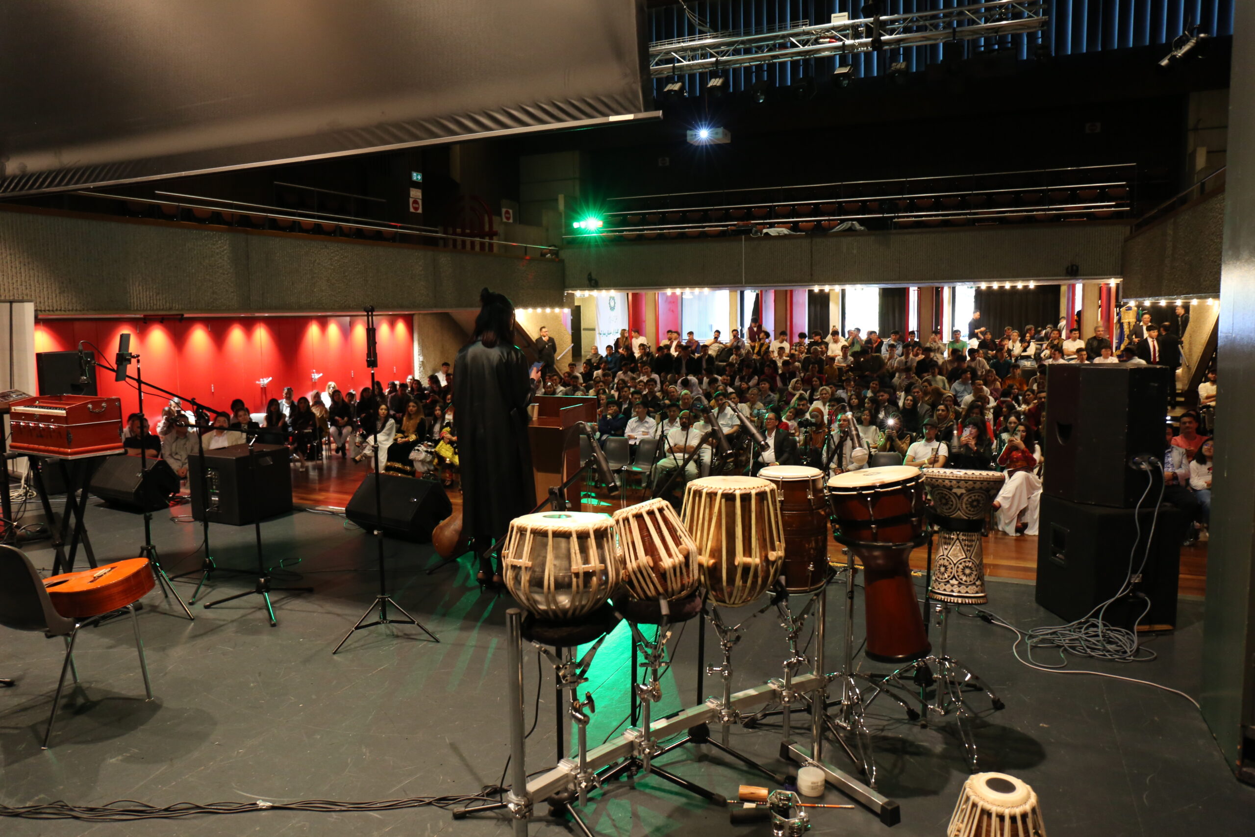 Golden mountain peaks at sunrise with scattered trees.