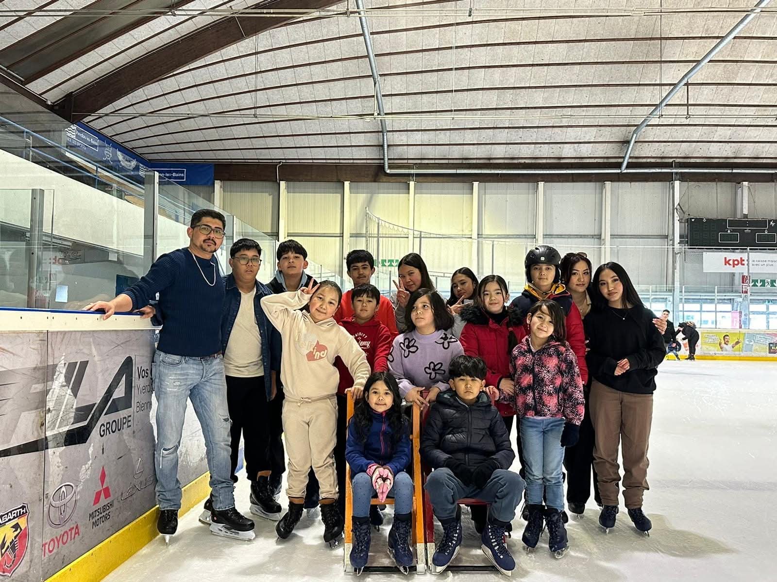 Golden mountain peaks at sunrise with scattered trees.